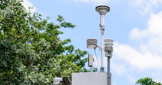 Photograph shows a weather station that transmits weather information to ThingSpeak, which is well suited for air quality monitoring.